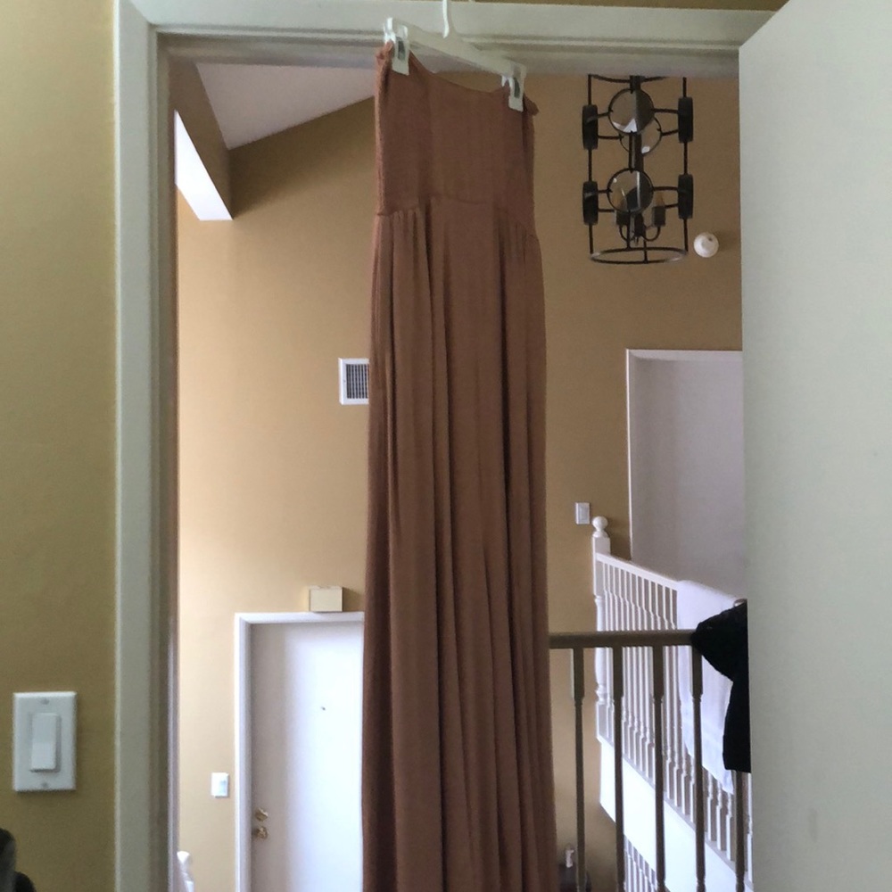 Free people peach colored jumpsuit.